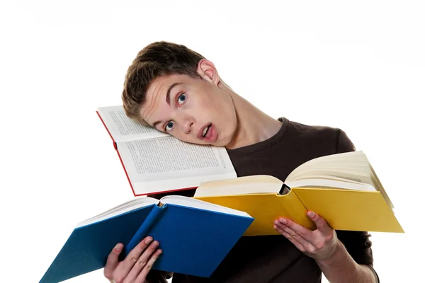 Νεαρός φοιτητής κατά την εκμάθηση με βιβλία — Φωτογραφία Αρχείου