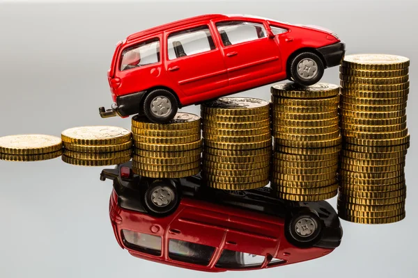 Rising car costs. car on coins — Stock Photo, Image