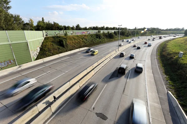 Cars drive on a highway — Stock Photo, Image