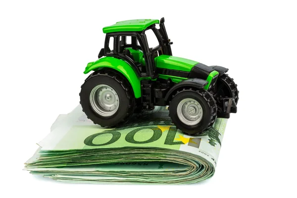 Tractor on euro banknotes — Stock Photo, Image