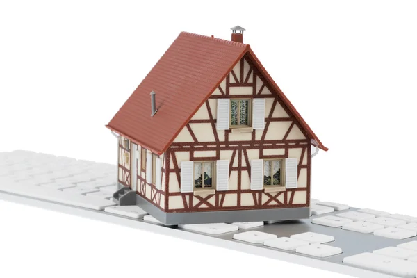 Haus auf Tastatur — Stockfoto