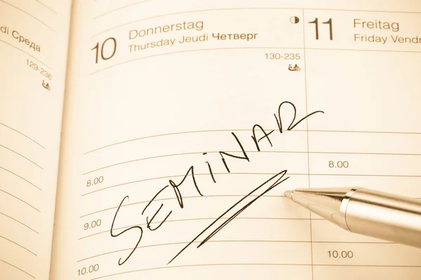 Oppføring i kalenderen: seminar – stockfoto