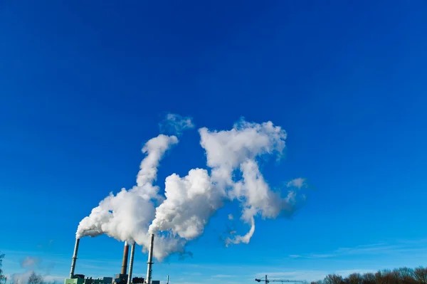 Smoking chimneys of a factory — Stock Photo, Image