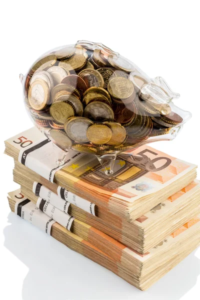 Piggy bank on euro banknotes — Stock Photo, Image