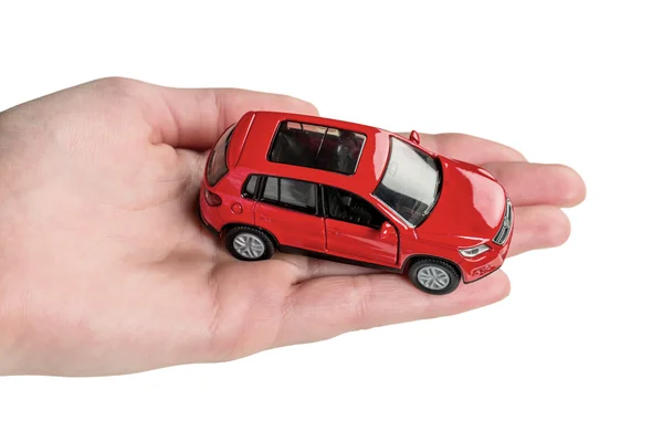 La mano guarda el modelo del automóvil — Foto de Stock