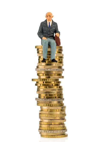 Pensioners sitting on a pile of money — Stock Photo, Image