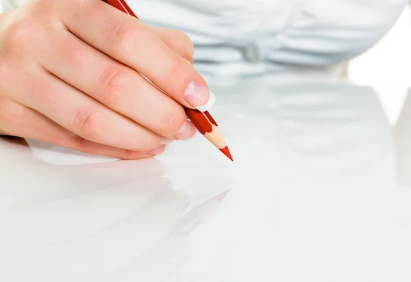 Hand with red pencil — Stock Photo, Image