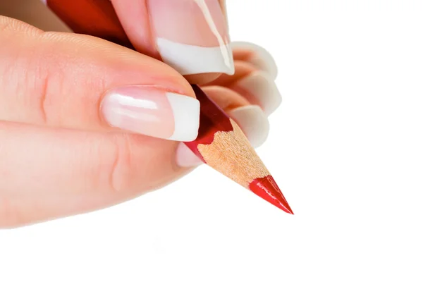 Hand met rood potlood — Stockfoto