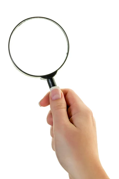 Hand with a magnifying glass — Stockfoto