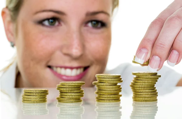 Woman stacking coins — Stock Photo, Image