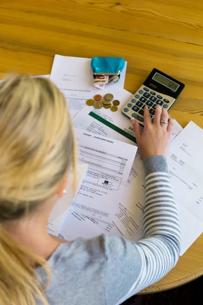 Woman with debts and bills — Stock Photo, Image