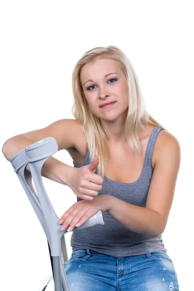 Woman with crutches — Stock Photo, Image