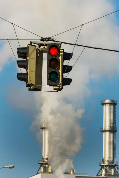 Industrial chimney and red traffic lights — Stock Photo, Image