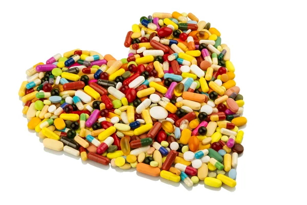Барвисті таблетки у формі серця — стокове фото