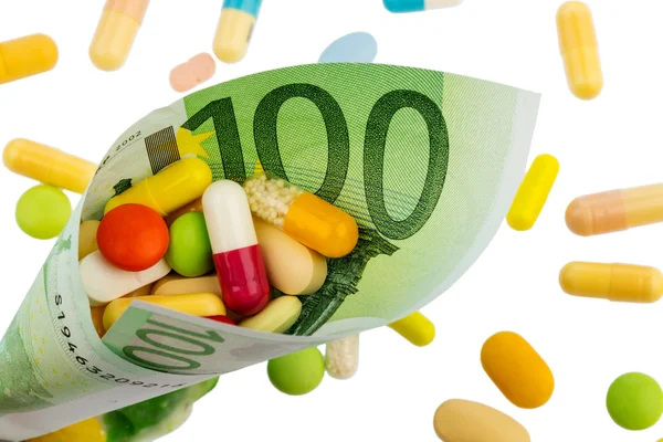 Tabletter och hundra euro bill — Stockfoto
