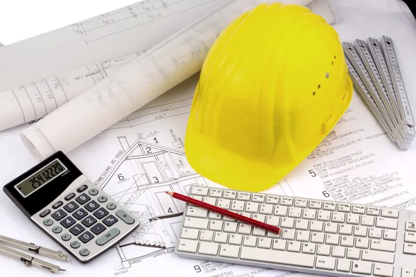 House plan with a construction worker's helmet — Stock Photo, Image
