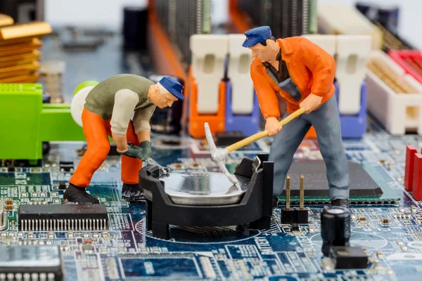 Computer board and construction workers — Stock Photo, Image