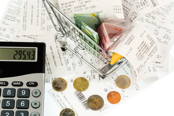 Shopping cart, receipts and money — Stock Photo, Image