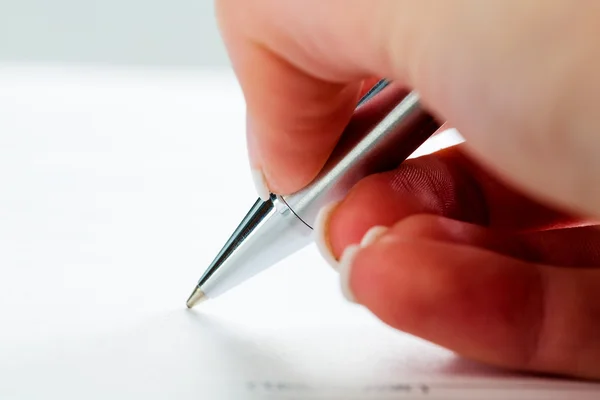 Hand with fountain pen with signature — Stock Photo, Image