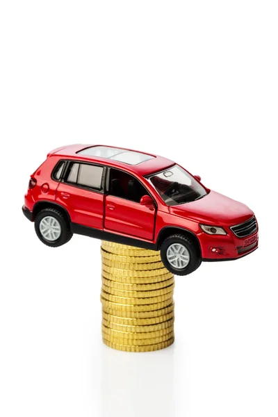 Rising motoring costs. car on coins — Stock Photo, Image