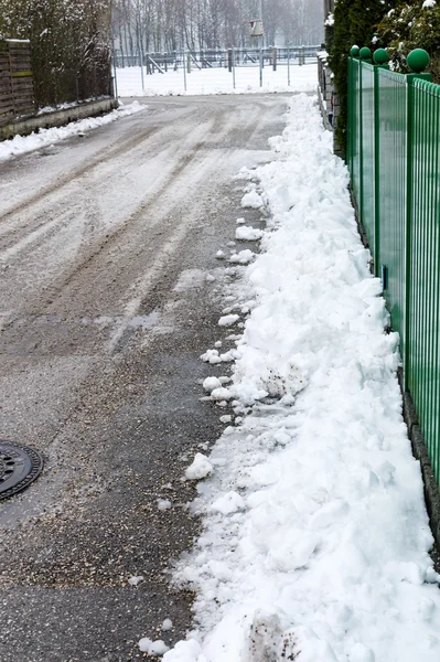 Snow on sidewalk — Stock Photo, Image
