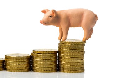 Pig on stack of coins clipart