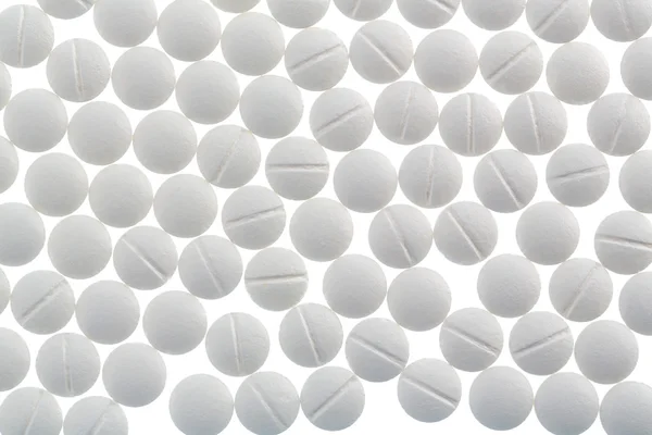 Bílé tablety v hojnosti — Stock fotografie
