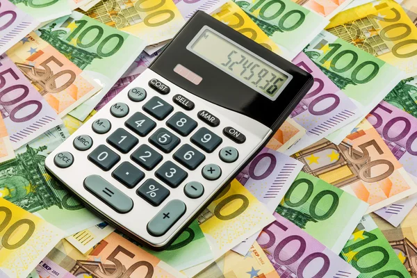 Calculator and euro banknotes — Stock Photo, Image