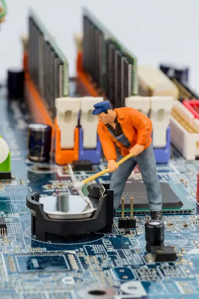 Computer board and construction workers — Stock Photo, Image