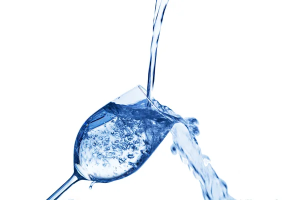 Water is poured into a water glass — Stock Photo, Image