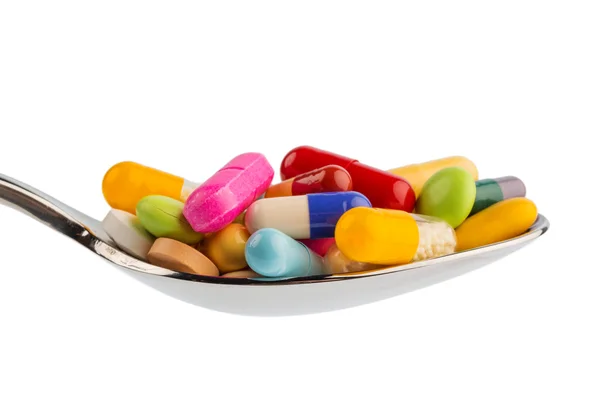 Hány tablettát a kanál — Stock Fotó