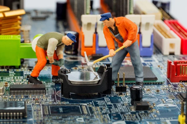 Computer board and construction workers — Stock Photo, Image