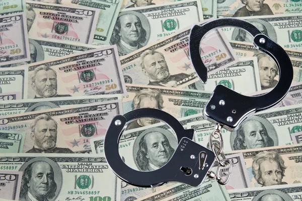 Dollar bills with handcuffs — Stock Photo, Image