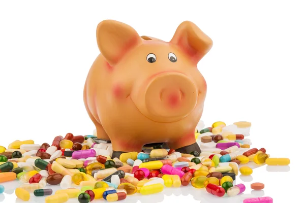 Tablets and piggy bank — Stock Photo, Image