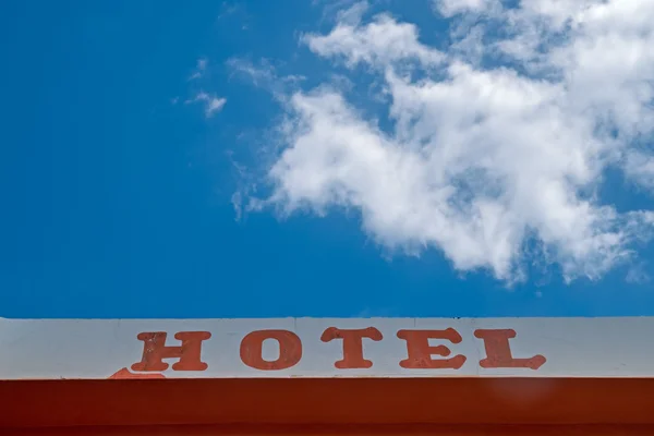 Hotel sign, text at building facade wall — Stock Photo, Image