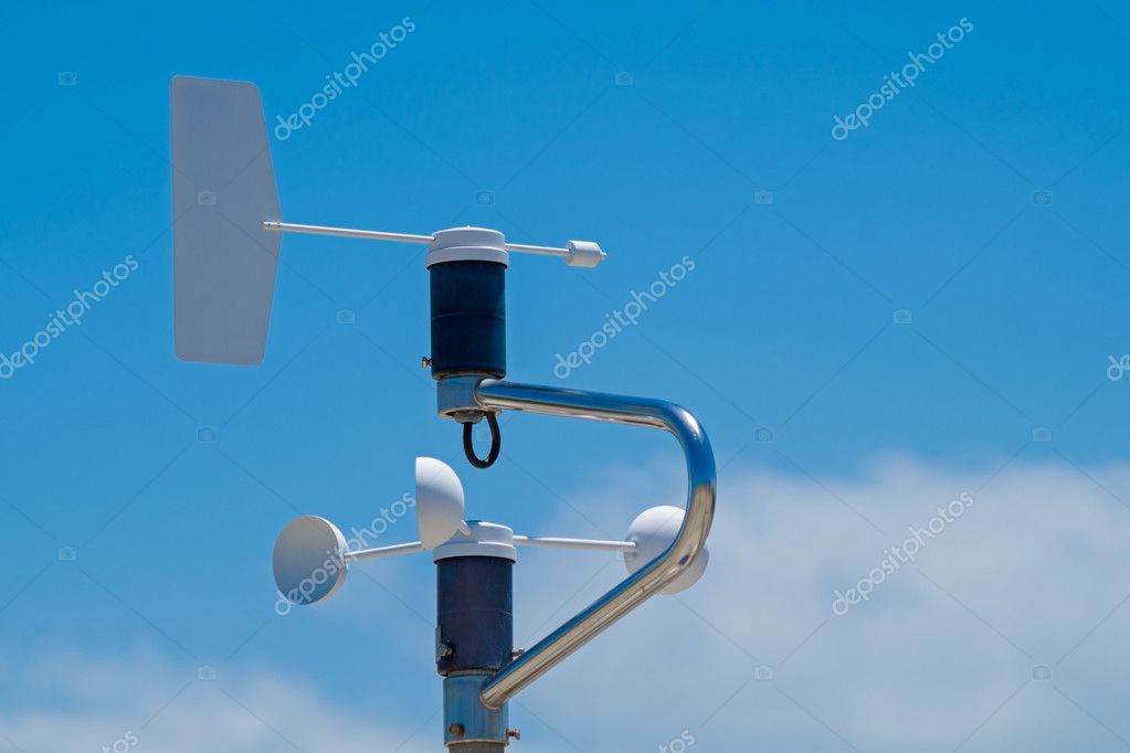 Anemometer, blue sky with clouds as background Stock Photo by