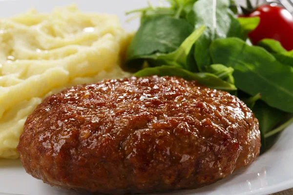 Meat patty on a plate — Stock Photo, Image