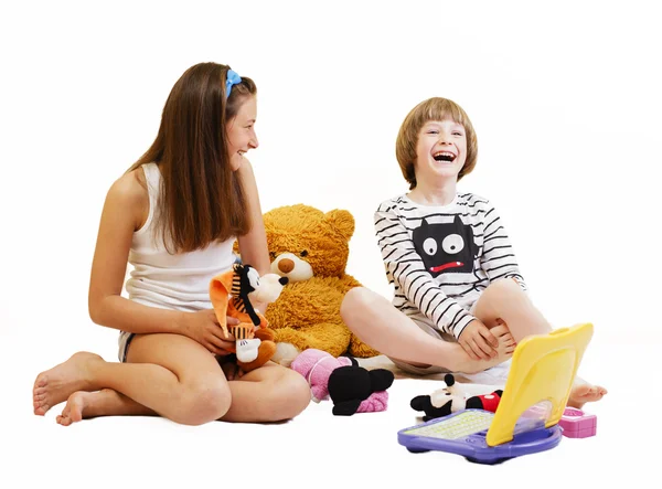 Boy and girl playing with toys — Stock Photo, Image