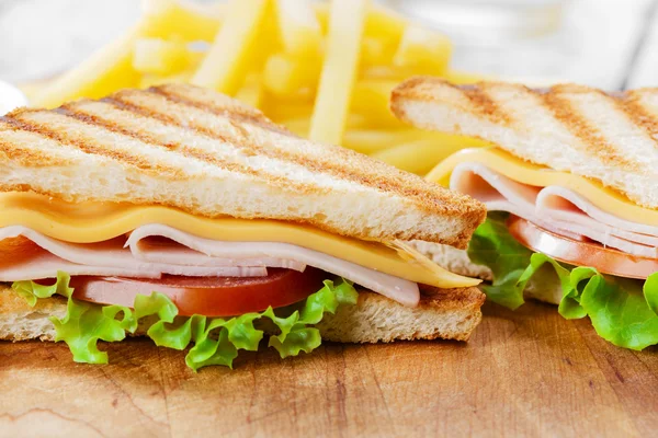 Grilled sandwich with ham cheese  french fries — Stock Photo, Image