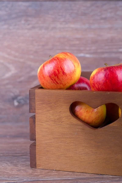 Apple in a box — Stock Photo, Image