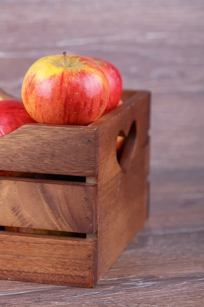 Apple in a box — Stock Photo, Image