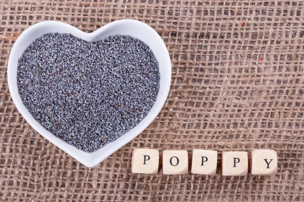 Poppy seed in  cup — Stock Photo, Image