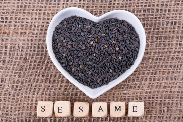 Sesame in cup — Stock Photo, Image