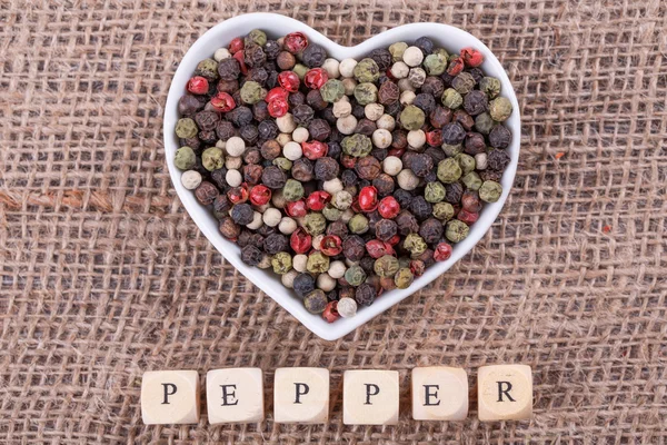 Pepper on  sack  cloth — Stock Photo, Image