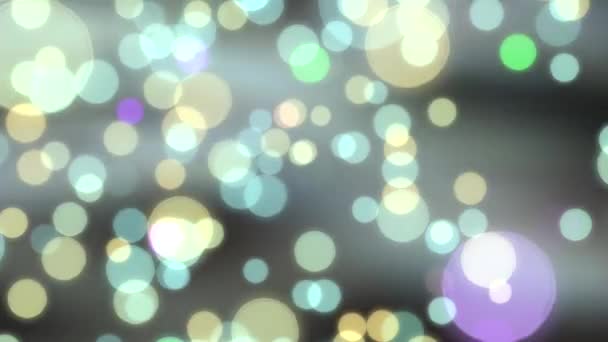 Glödande färgad bokeh bakgrund med flytande ljus partiklar — Stockvideo