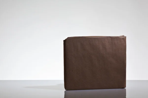 Parcels wrapped up in brown papper — Stock Photo, Image