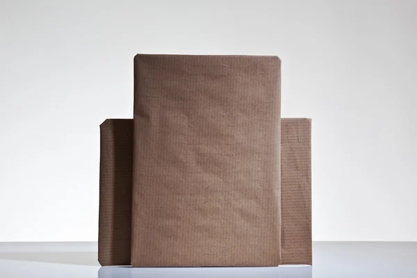 Parcels wrapped up in brown papper — Stock Photo, Image