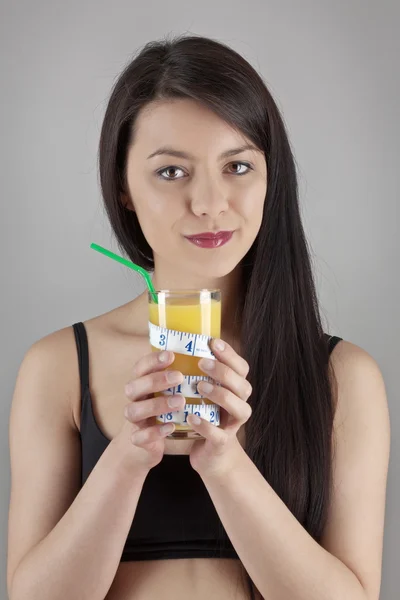 Drinking orange juice — Stock Photo, Image