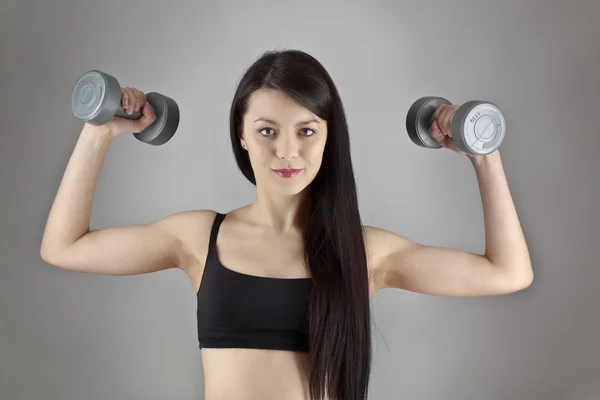 Working out with dumbbell — Stock Photo, Image