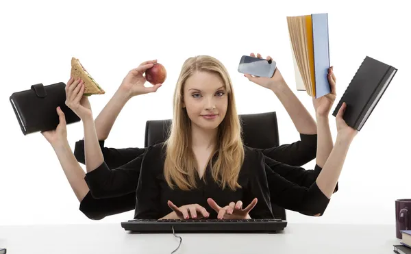 Mujer ocupada en su escritorio —  Fotos de Stock